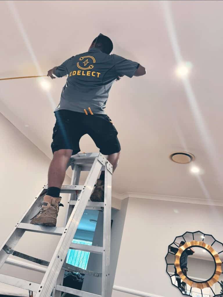 Edgar a Newcastle Electrician Installing a Light